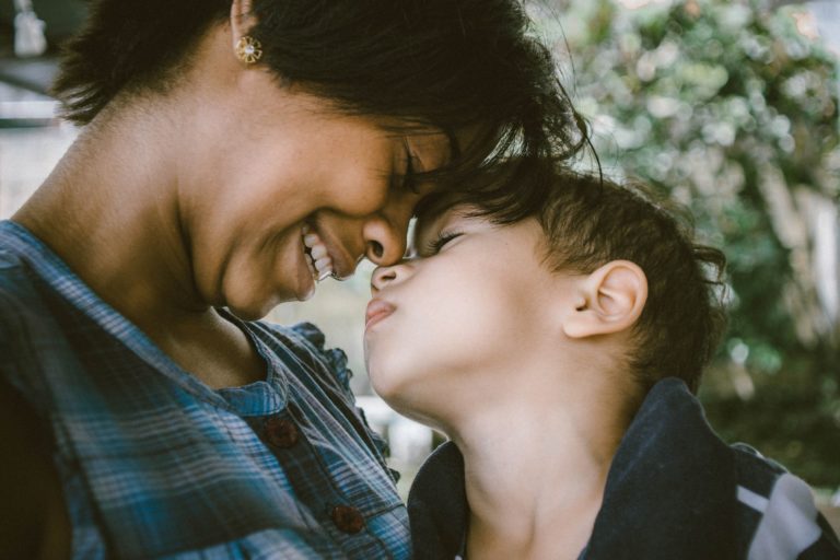 a man kissing a woman