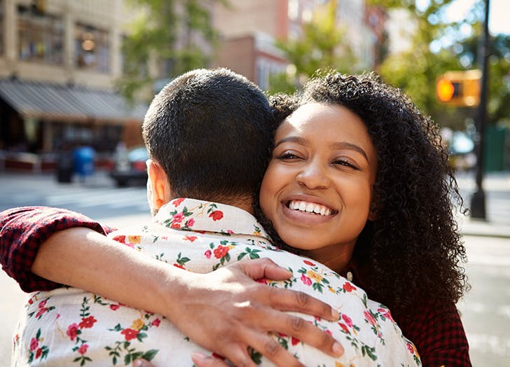 a man and woman smiling