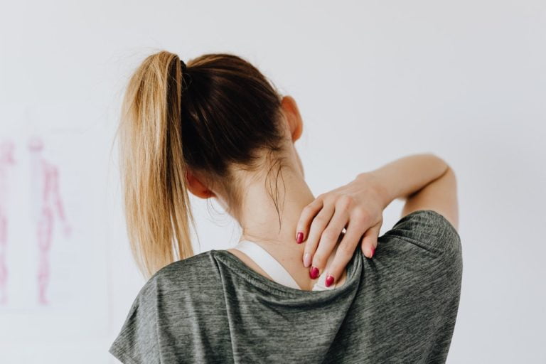 a woman with her hand on her chin