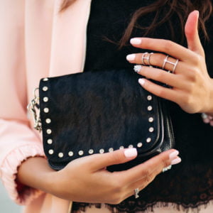 female holding purse